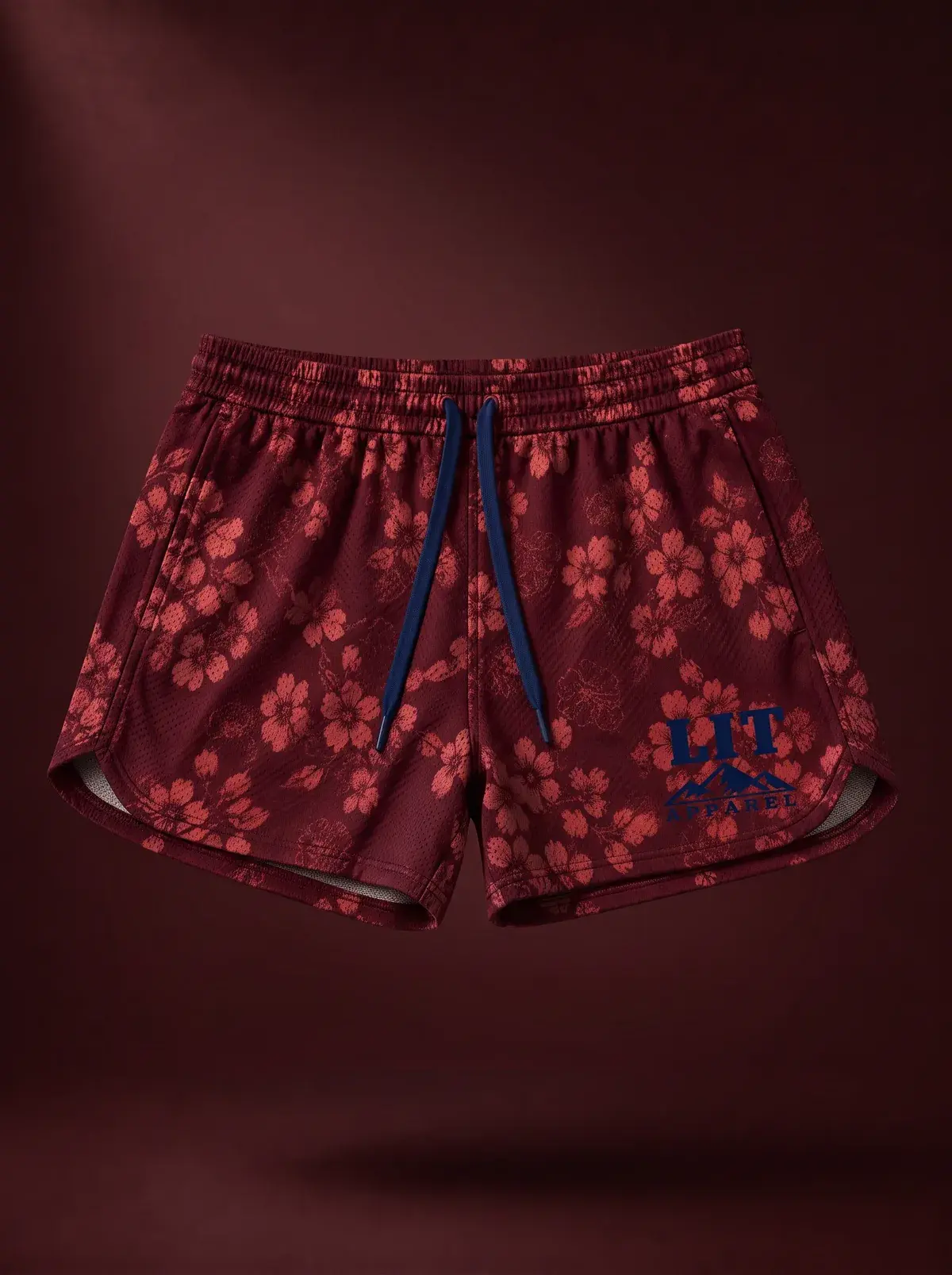 Athletic Mesh Dolphin Shorts — Burgundy Floral in Burgundy Floral, photographed front-on against a paper ground.