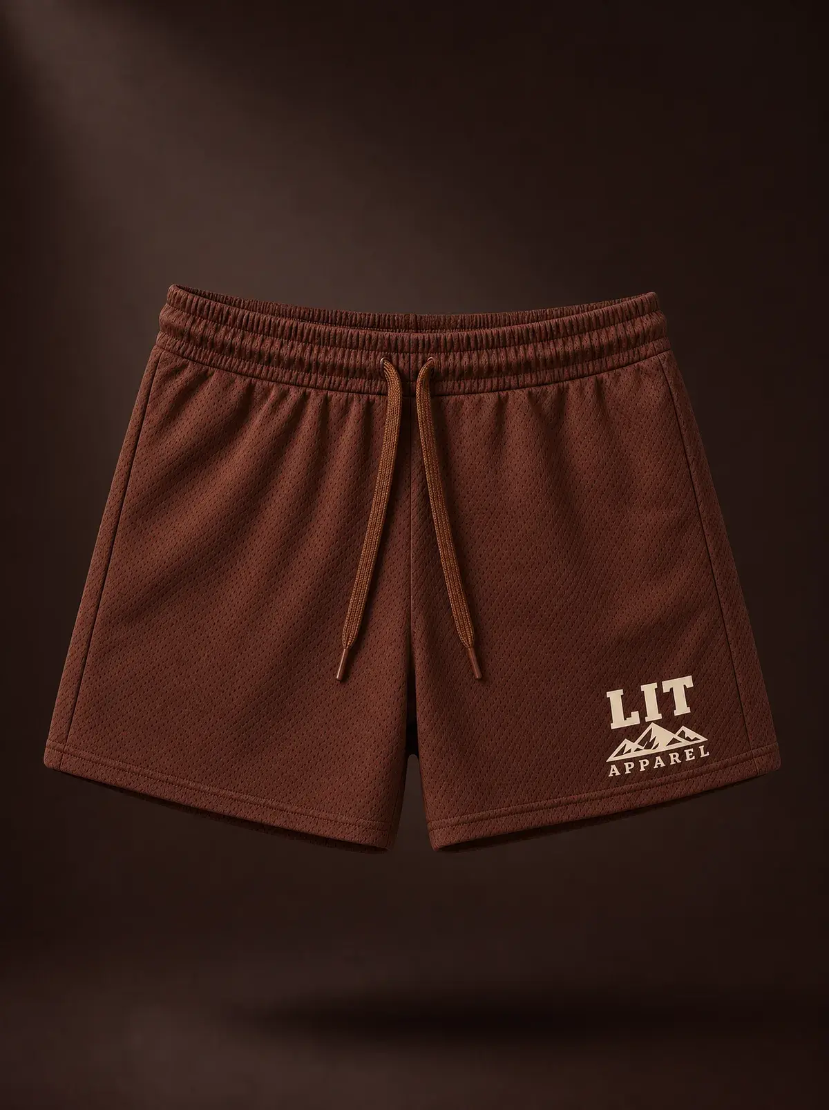 Athletic Mesh Dolphin Shorts — Cocoa in Cocoa, photographed front-on against a paper ground.