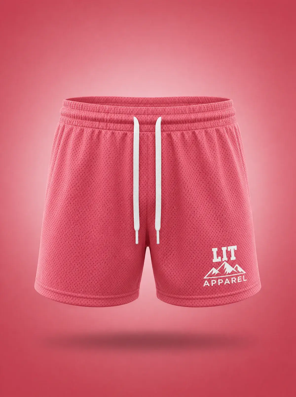 Athletic Mesh Dolphin Shorts — Pink in Coral Pink, photographed front-on against a paper ground.