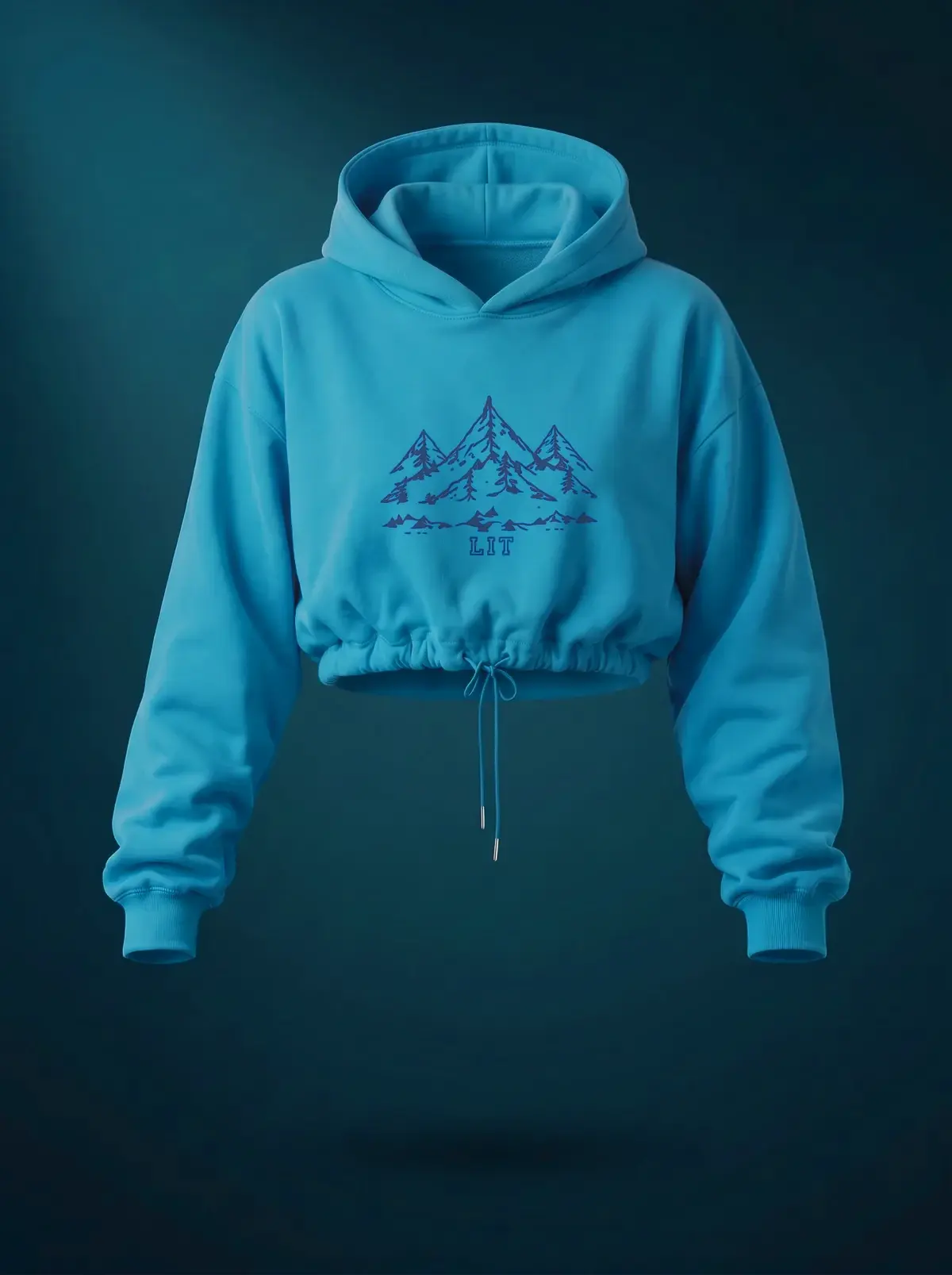 Cropped Mountain Hoodie in Summit Teal, photographed front-on against a paper ground.