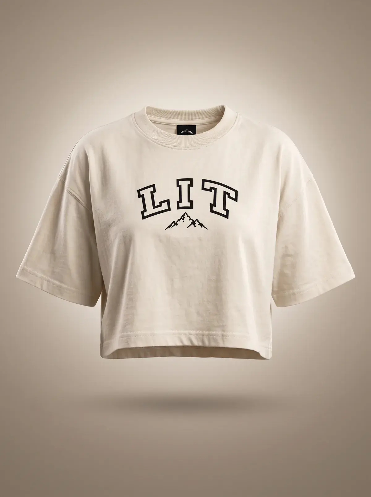 LIT Oversized Crop Tee — Cream in Natural Cream, photographed front-on against a paper ground.