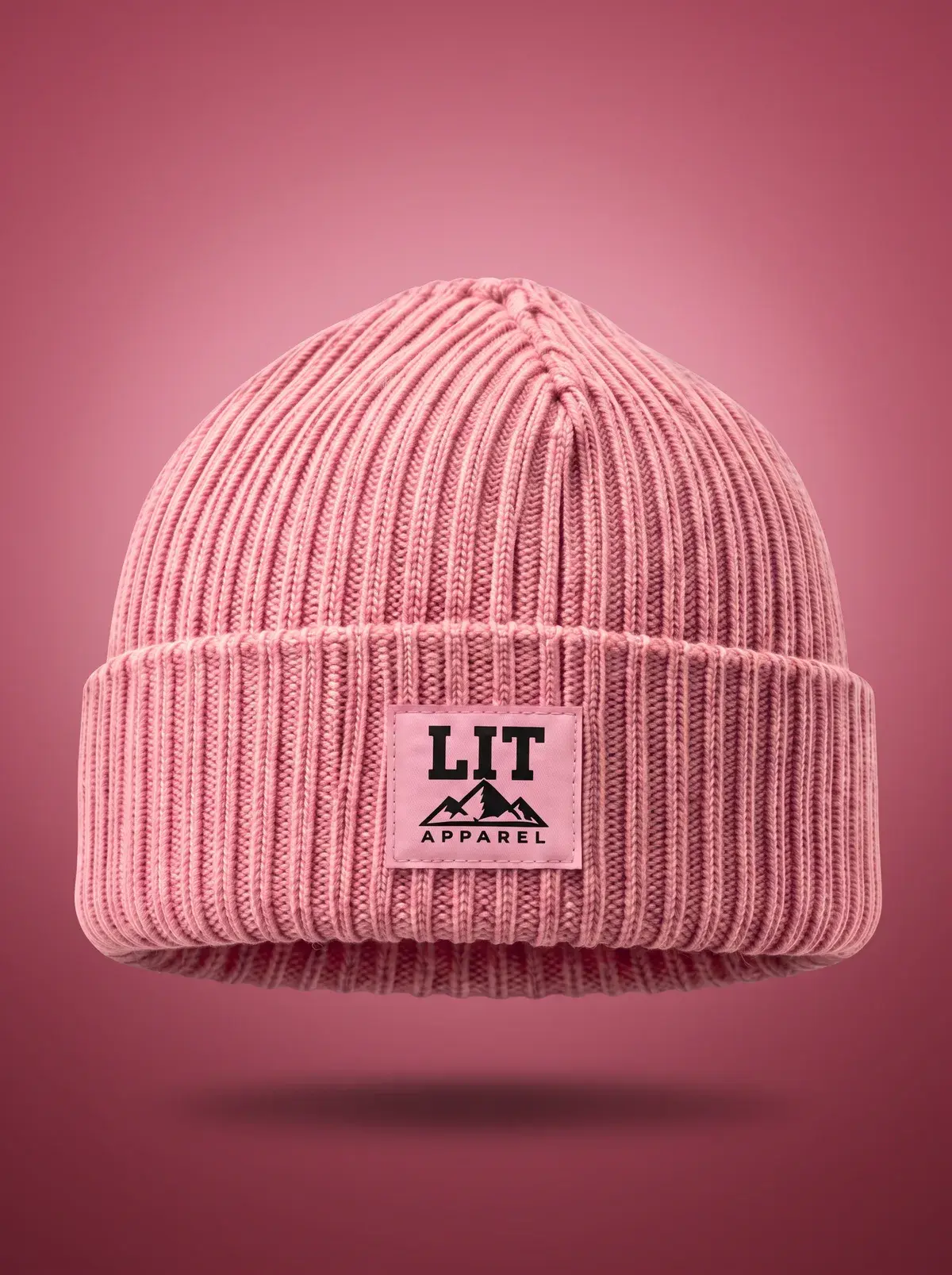 Ribbed Cuffed Beanie — Pink in Summit Pink, photographed front-on against a paper ground.